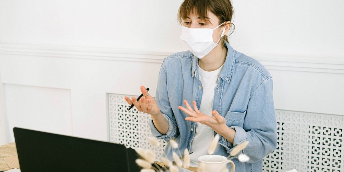 Canva - Woman in Face Mask Having Video Call